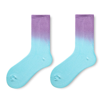 Pair of socks with a gradient from purple to blue on a white background