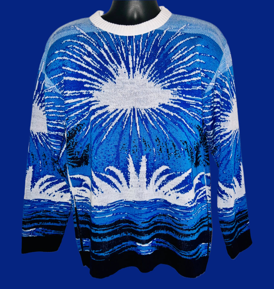 Blue and white patterned sweater on a mannequin against a white background