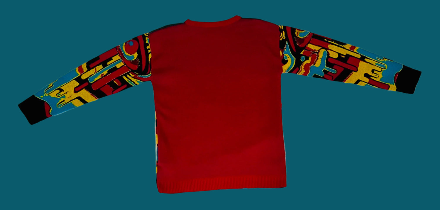 Red long-sleeve shirt with colorful sleeves on a white textured surface
