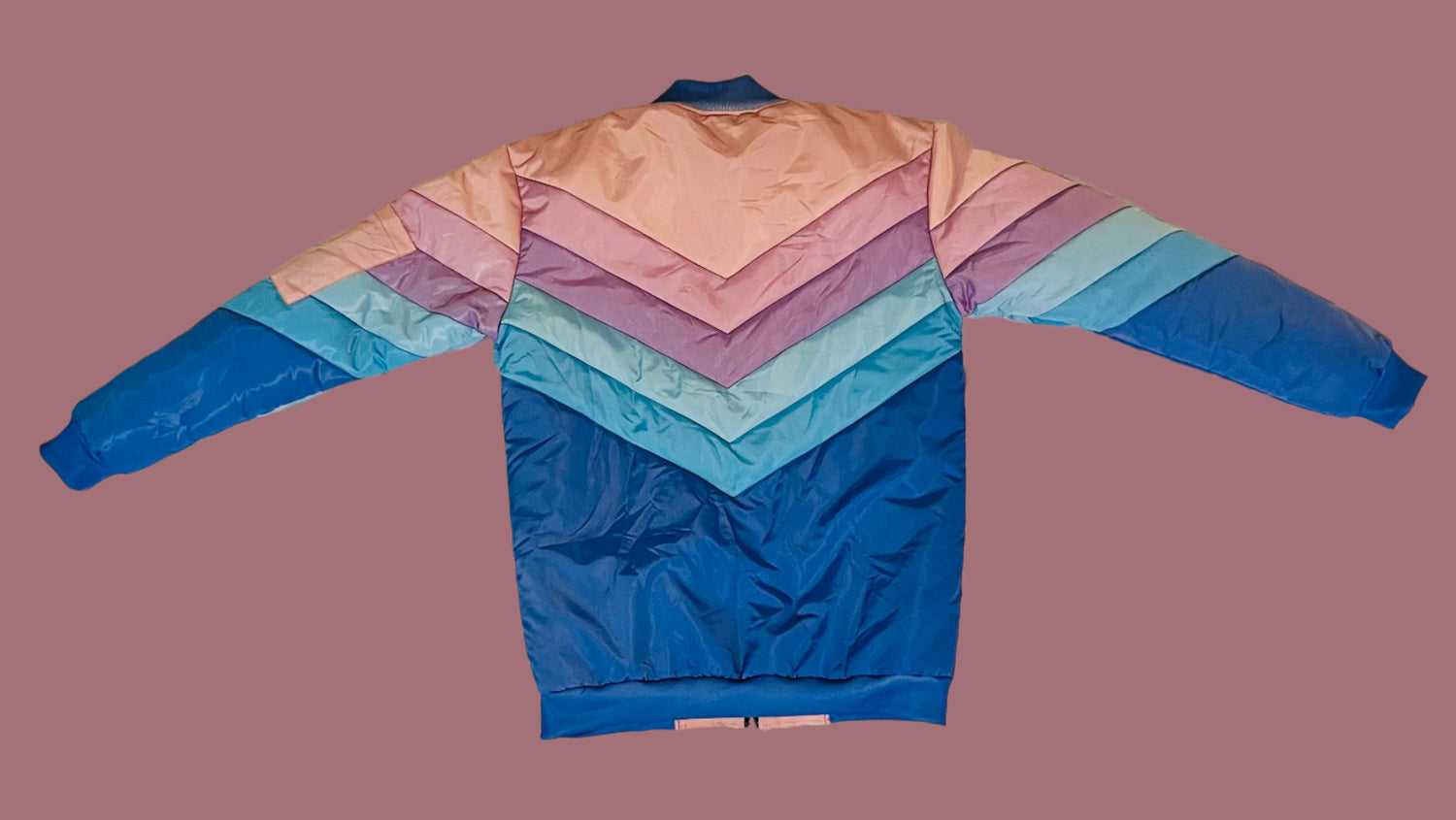 Colorful jacket with a gradient pattern on a white textured surface