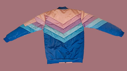 Colorful jacket with a gradient pattern on a white textured surface