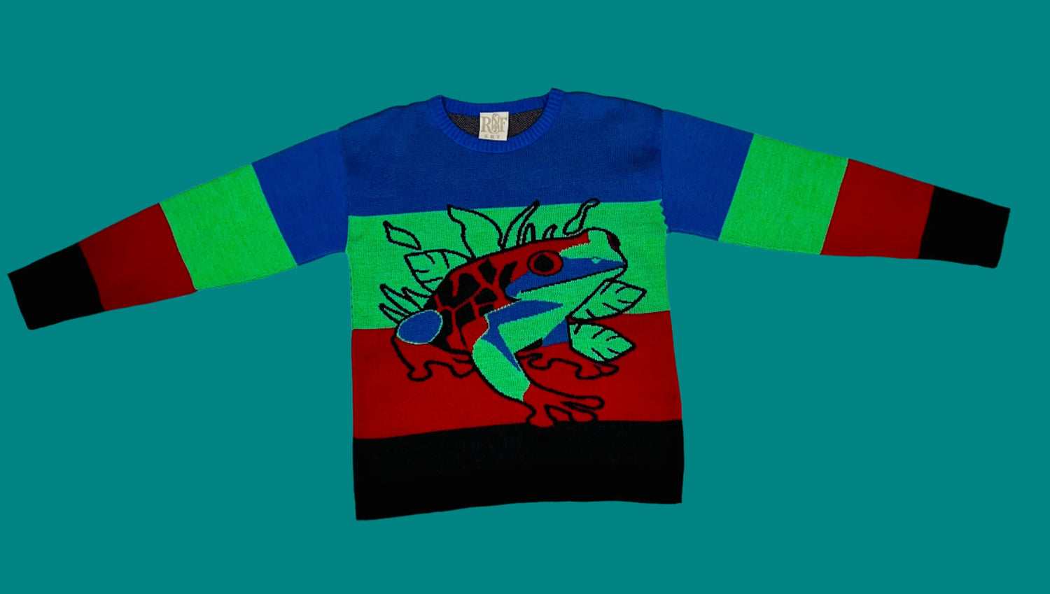 Colorful sweater with a graphic design on a white background