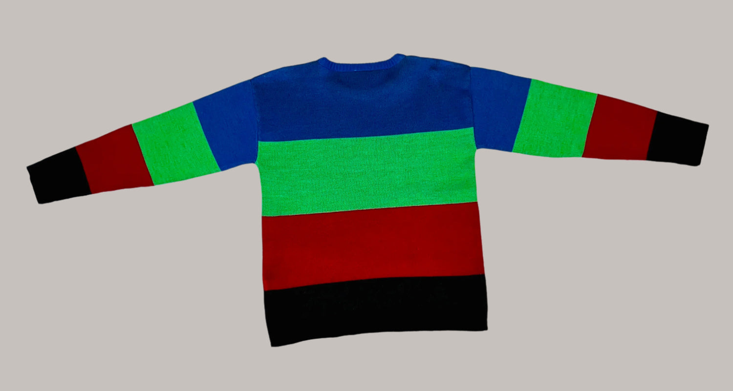 Color-blocked sweater with blue, green, red, and black sleeves on a white textured background