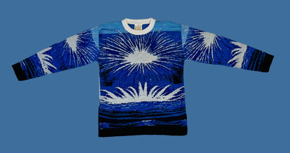 Blue sweater with white abstract design on a white background